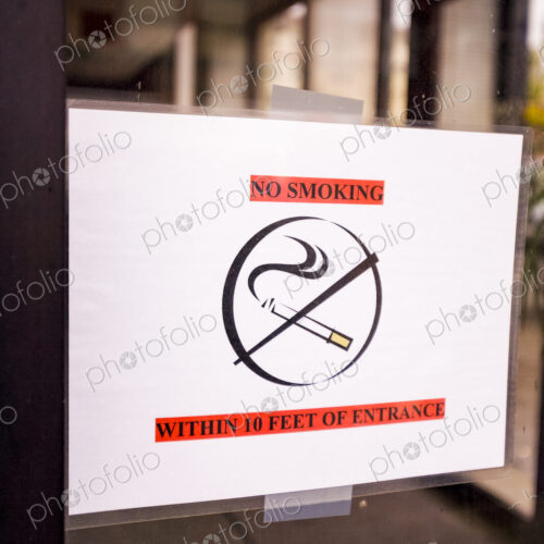 No smoking sign on a glass door
