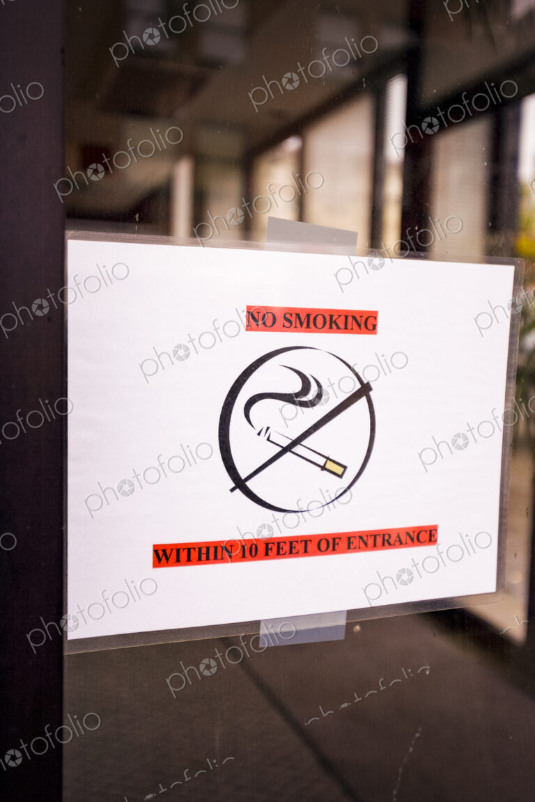 No smoking sign on a glass door