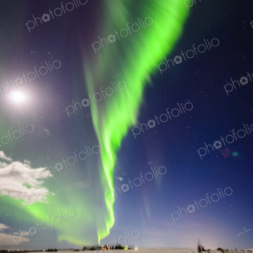 Northern lights in sky over snowy landscape Northern lights in sky over snowy landscape