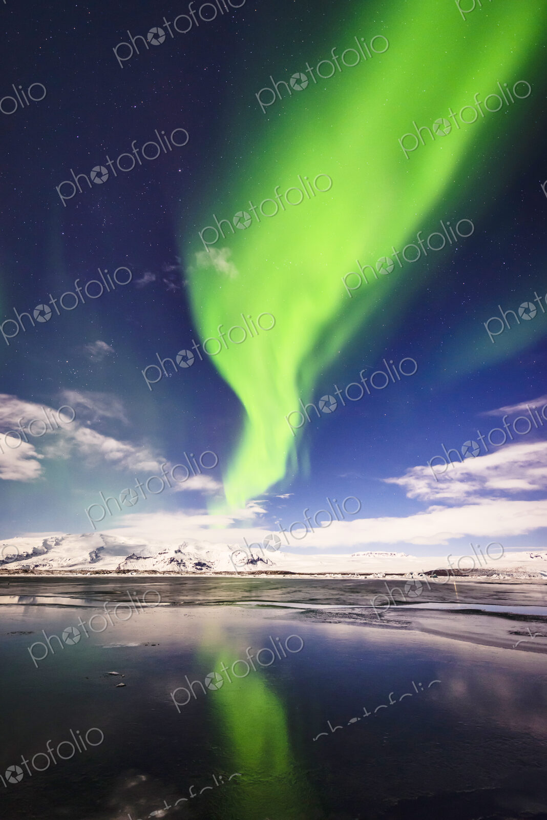 Northern lights reflecting in still remote river