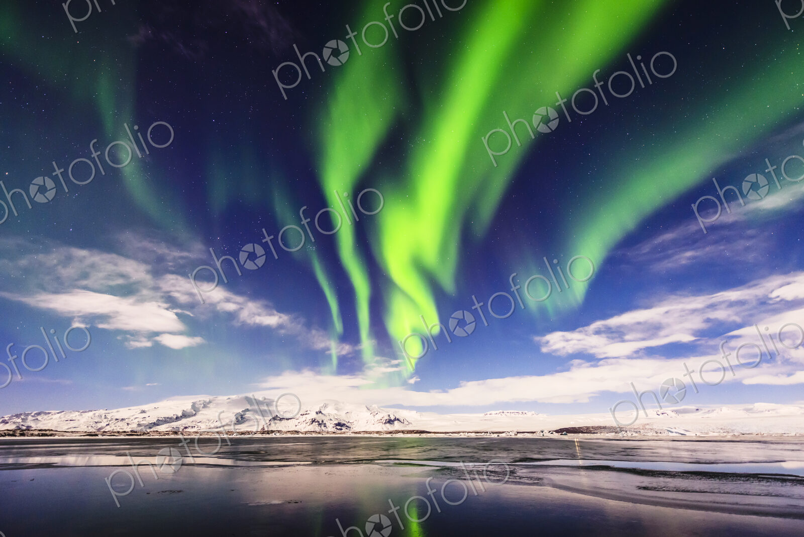 Northern lights reflecting in still remote river