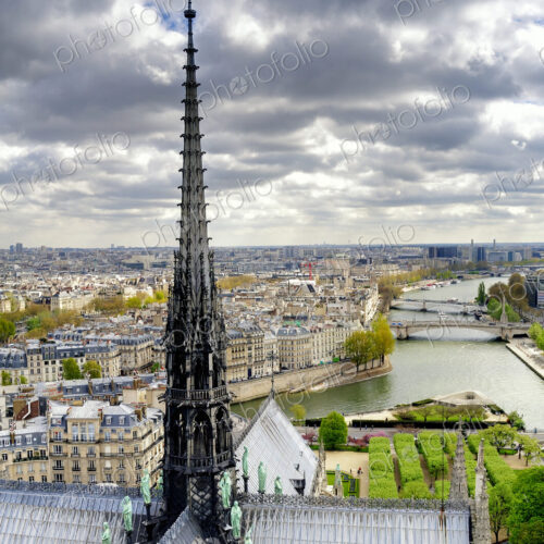 Notre Dame spire over Paris cityscape, Ile-de-France, France Notre Dame spire over Paris cityscape, Ile-de-France, France
