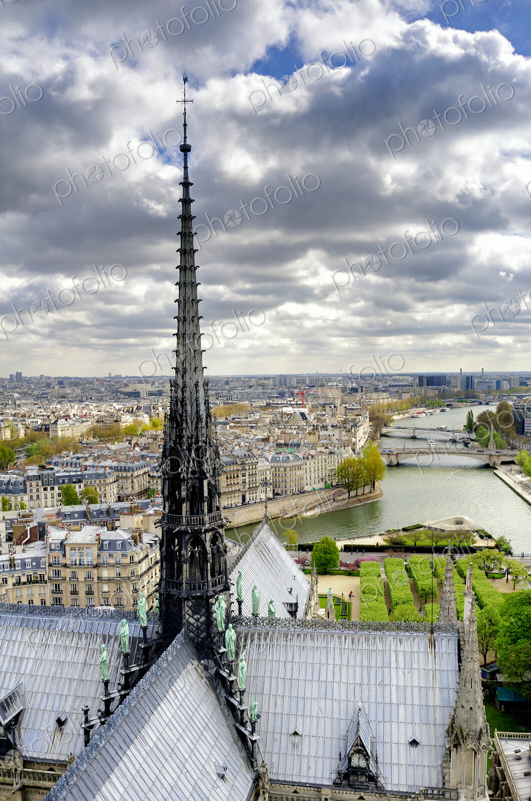 Notre Dame spire over Paris cityscape, Ile-de-France, France