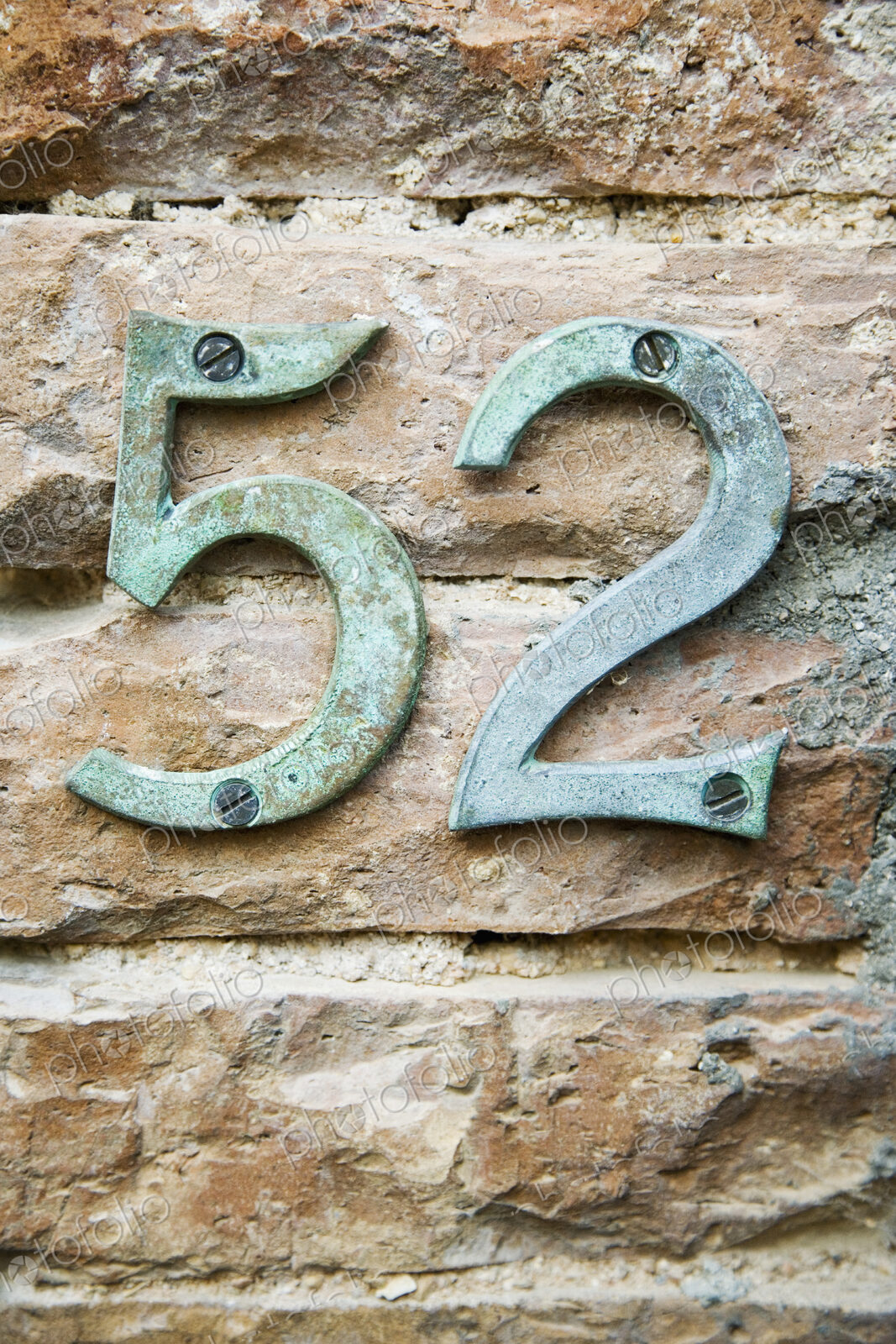 Number 52 on Brick Wall