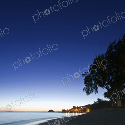 Oahu, Lanikai Beach at dawn, lightening sky on the horizon, beach and palm trees. Oahu, Lanikai Beach at dawn, lightening sky on the horizon, beach and palm trees.