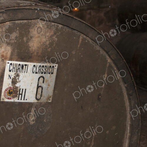 Oak barrel of Chianti wine in cellar in Tuscany.