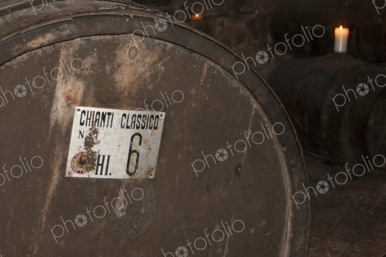 Oak barrel of Chianti wine in cellar in Tuscany.
