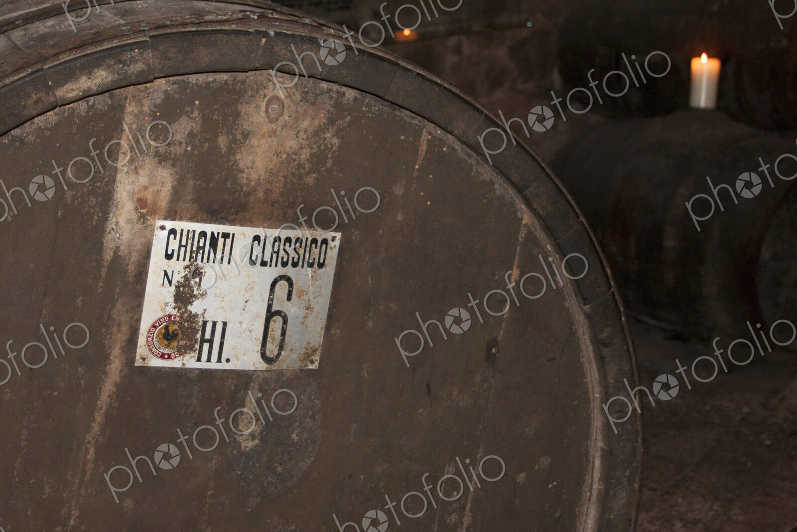Oak barrel of Chianti wine in cellar in Tuscany.