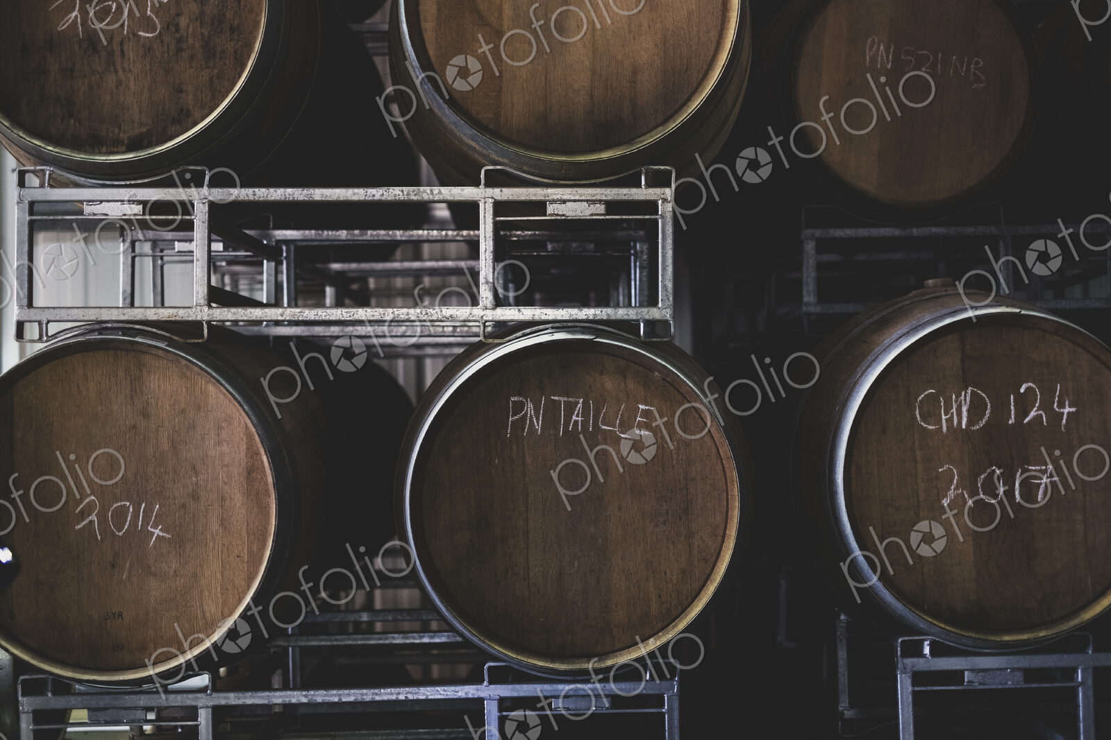 Oak wine barrels in a winery.