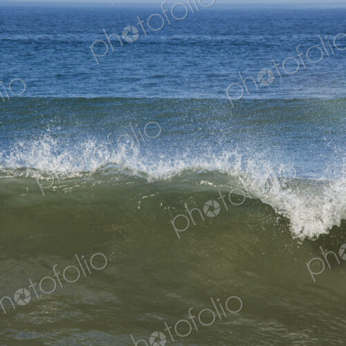 Ocean Waves reaching the shore, white water and spray.