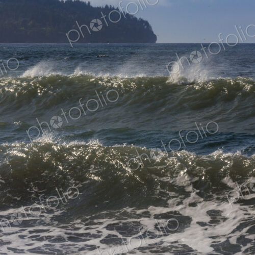 Ocean Waves reaching the shore, white water and spray.