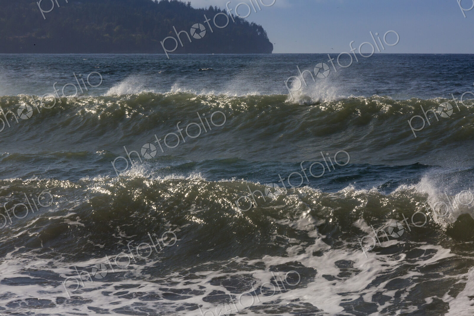 Ocean Waves reaching the shore, white water and spray.