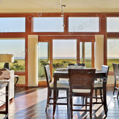 Ocean view through window in dining room Ocean view through window in dining room