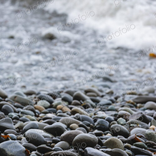 Ocean waves and smooth beach rocks, Strait of Juan de Fuca, Port Angeles