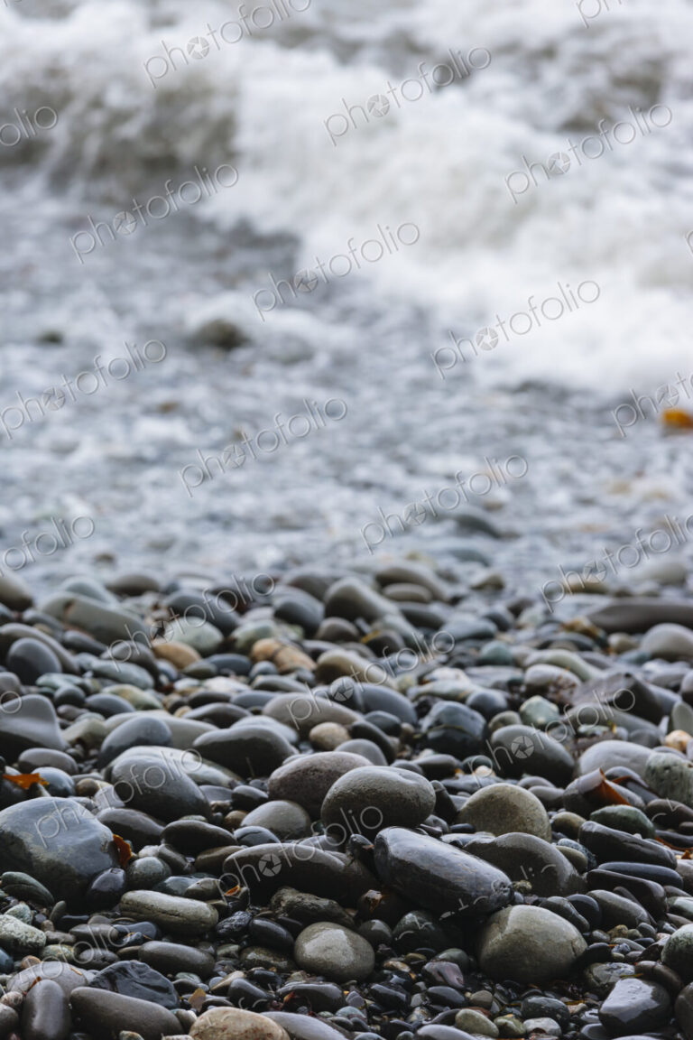 Ocean waves and smooth beach rocks, Strait of Juan de Fuca, Port Angeles