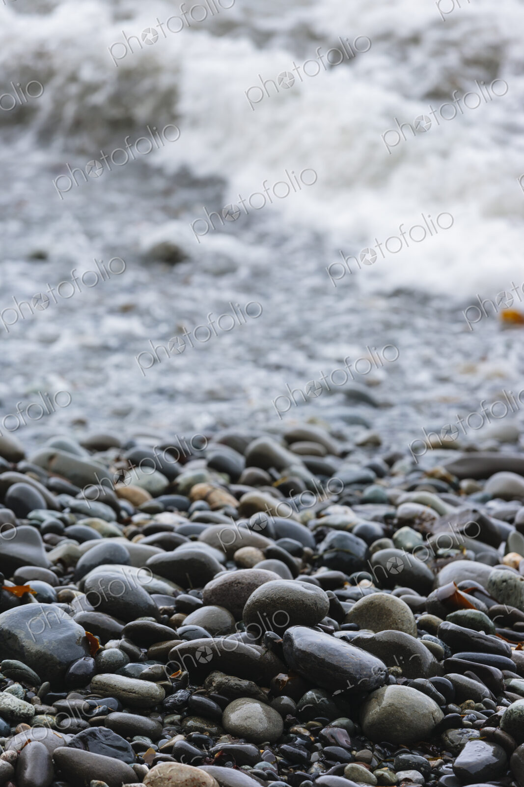 Ocean waves and smooth beach rocks, Strait of Juan de Fuca, Port Angeles