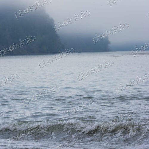 Ocean waves breaking on a beach of smooth rocks, Strait of Juan de Fuca, Port Angeles Ocean waves breaking on a beach of smooth rocks, Strait of Juan de Fuca, Port Angeles