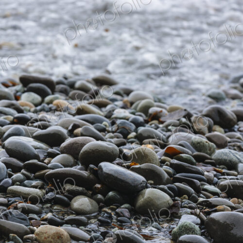 Ocean waves breaking on a beach, smooth beach pebbles, Strait of Juan de Fuca, Port…