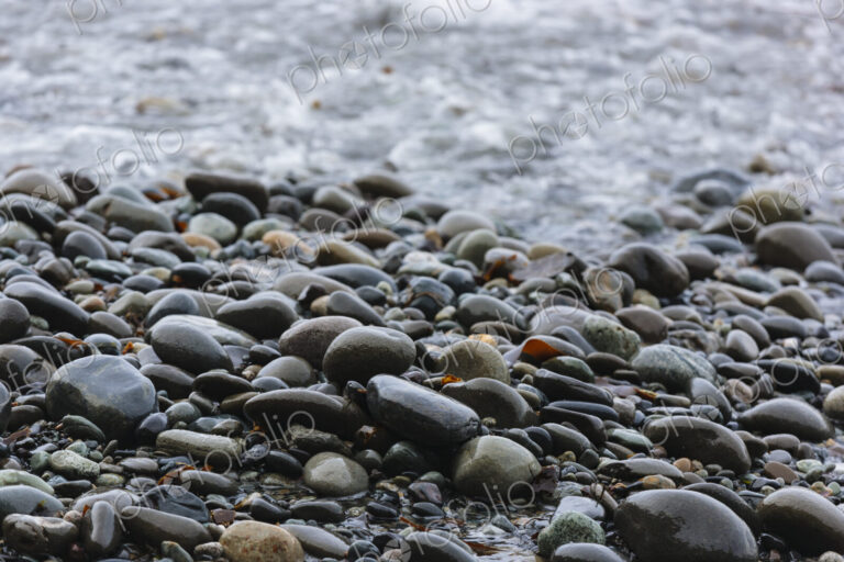 Ocean waves breaking on a beach, smooth beach pebbles, Strait of Juan de Fuca, Port…