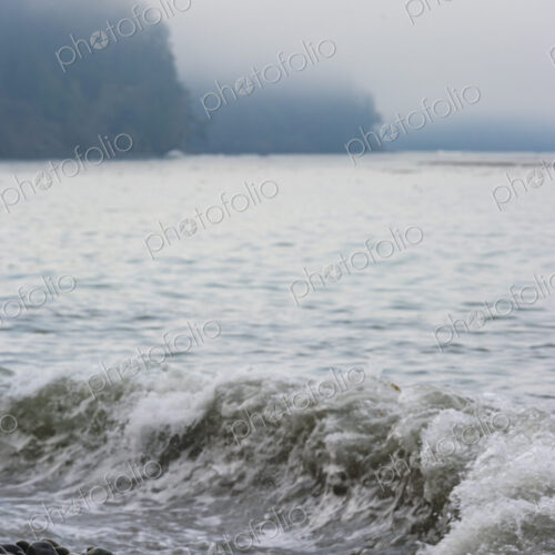 Ocean waves breaking over smooth beach pebbles, Strait of Juan de Fuca Ocean waves breaking over smooth beach pebbles, Strait of Juan de Fuca