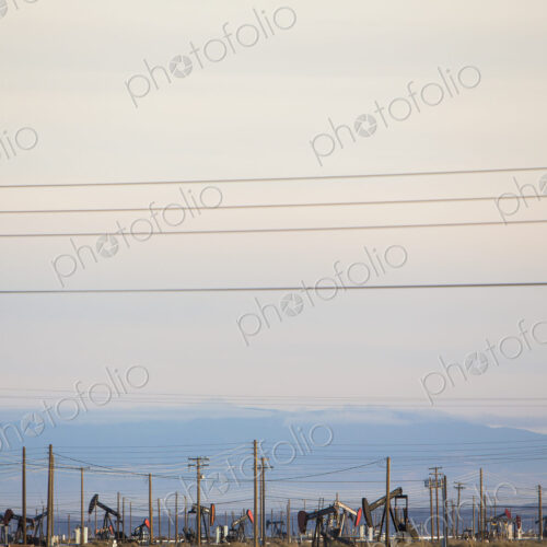 Oil rigs and power lines in the Midway-Sunset oil fields, the largest in California Oil rigs and power lines in the Midway-Sunset oil fields, the largest in California