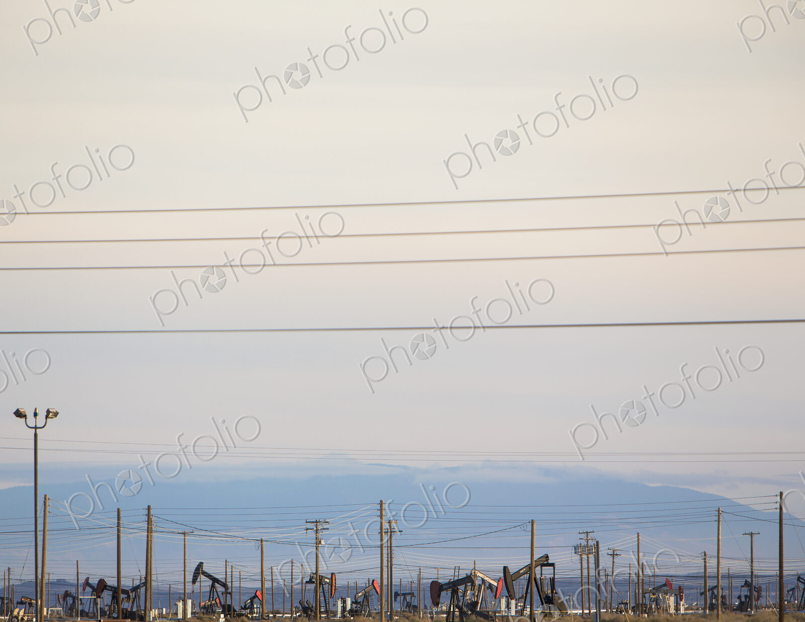 Oil rigs and power lines in the Midway-Sunset oil fields, the largest in California
