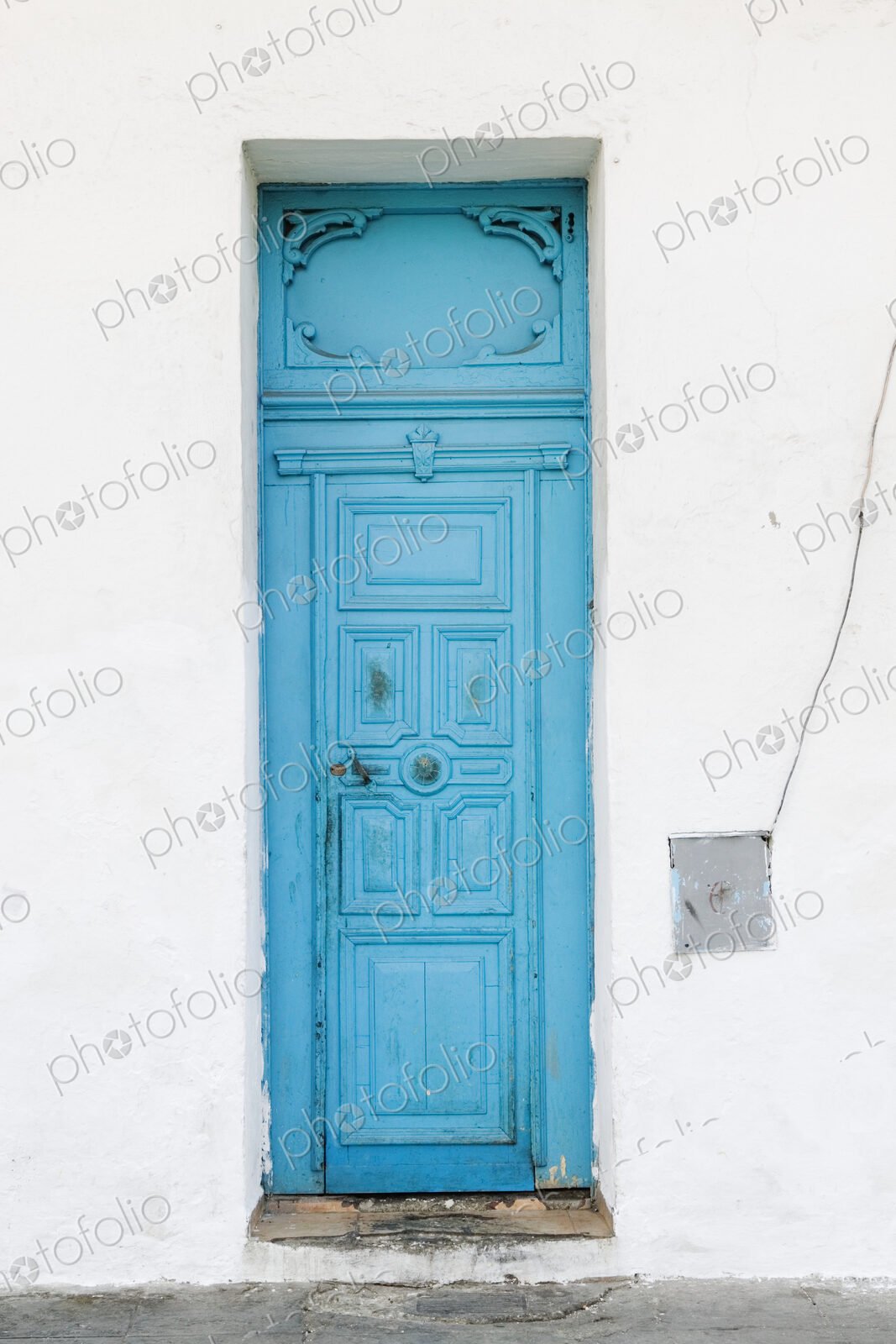 Old Blue Door on White Wall