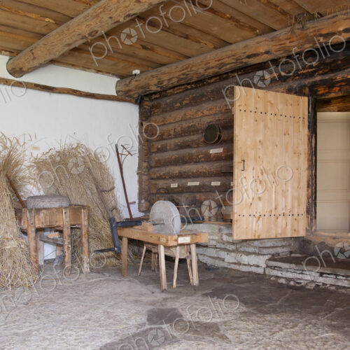 Old Fashioned Cabin porch With a Sharpening Stone