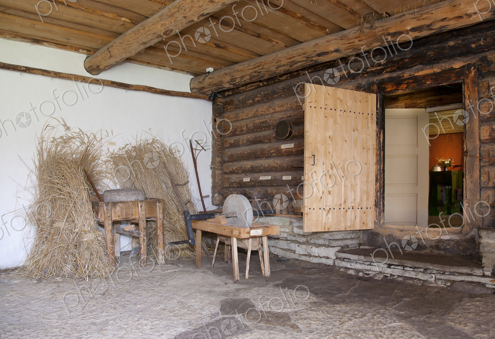 Old Fashioned Cabin porch With a Sharpening Stone