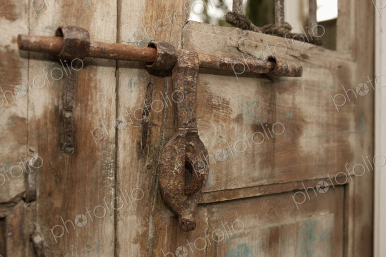 Old Iron Door Latch on Wooden Door