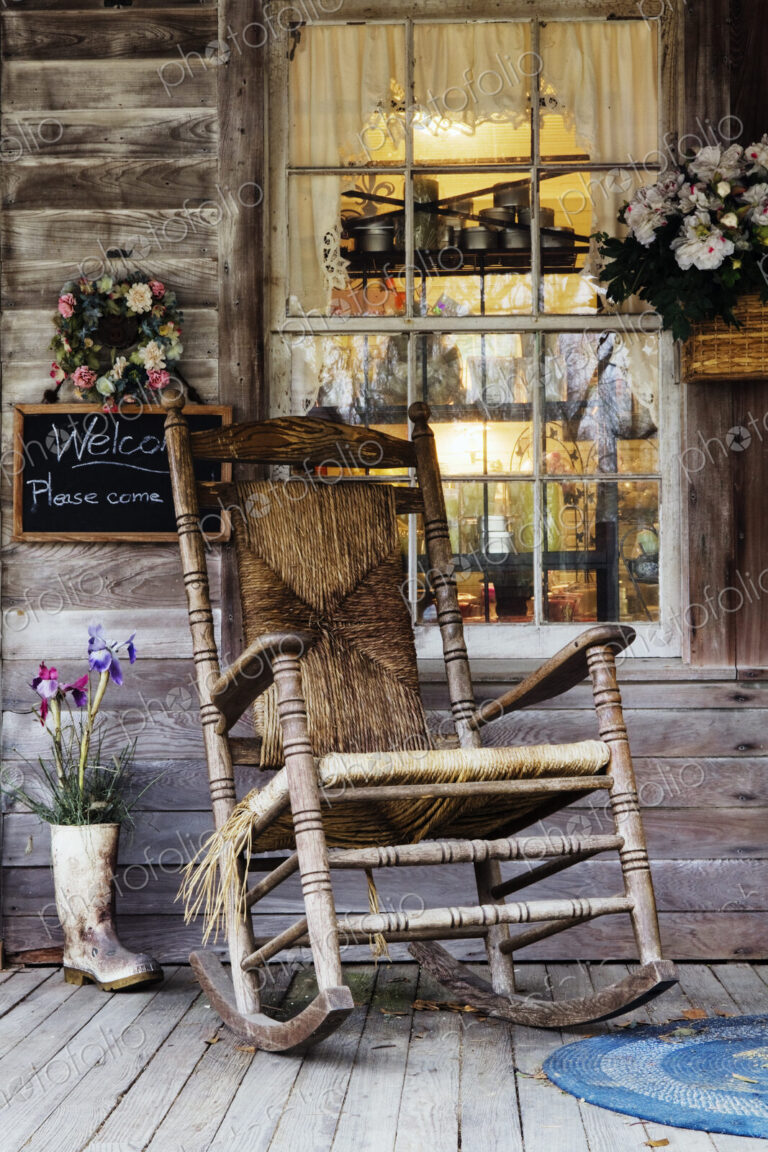 Old Wooden Rocking Chair on a Wooden Porch