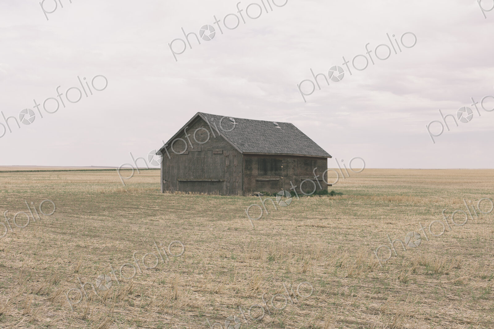 Old barn and fallow field,