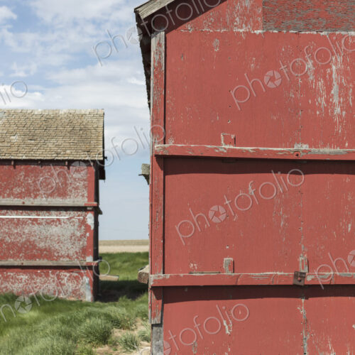 Old farm outbuildings on prairie,