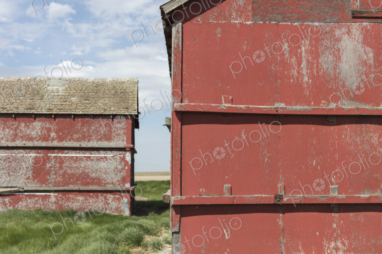 Old farm outbuildings on prairie,
