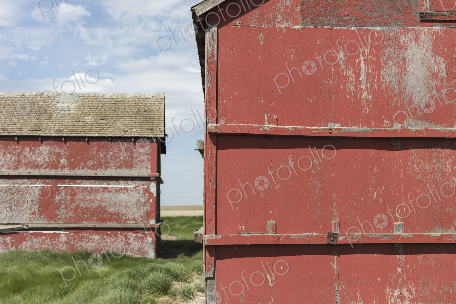 Old farm outbuildings on prairie,