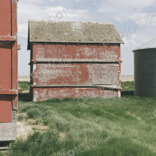 Old farm outbuildings on prairie,