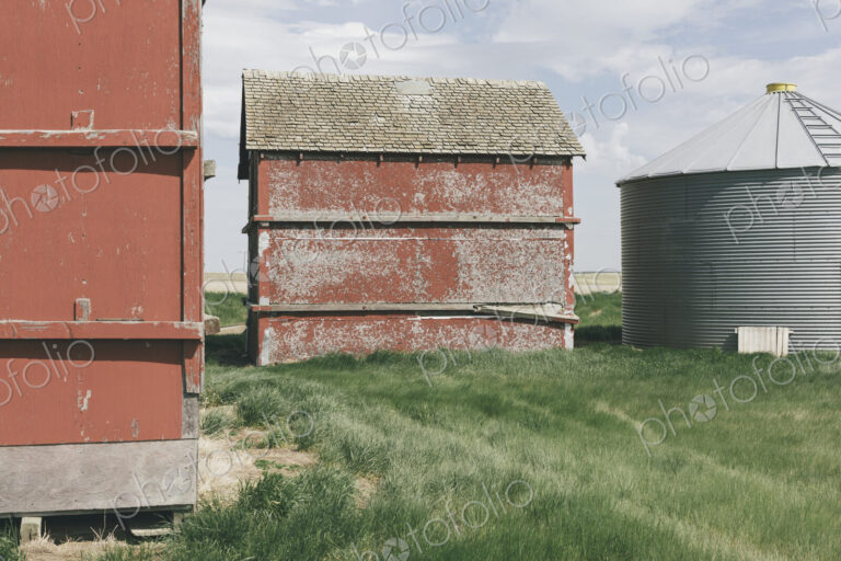 Old farm outbuildings on prairie,