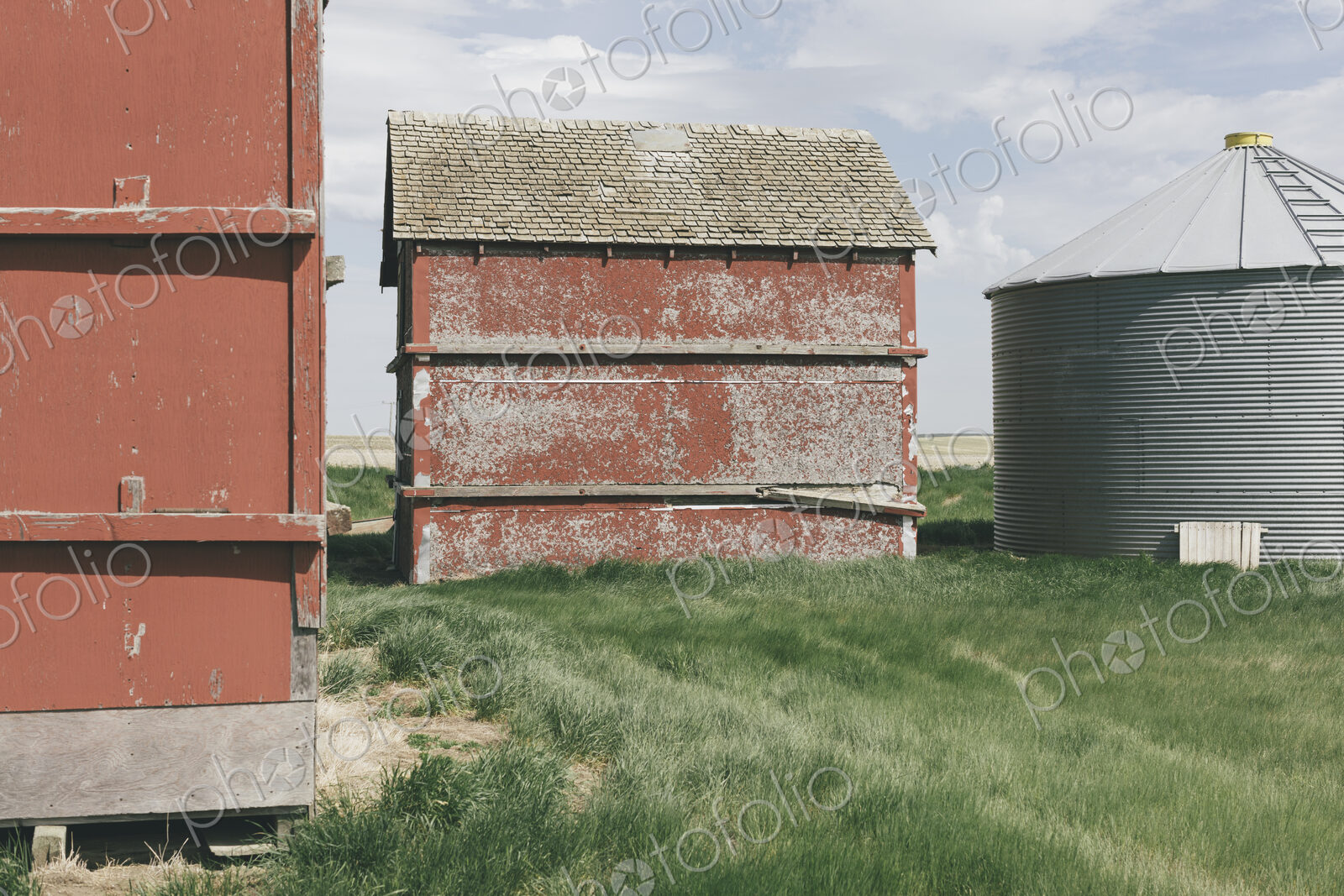 Old farm outbuildings on prairie,