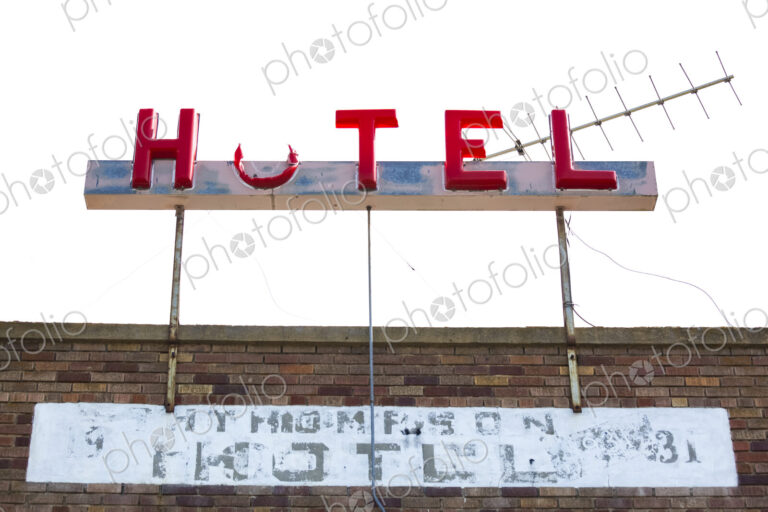 Old hotel sign, Coulee City, a broken sign with part of the O missing.