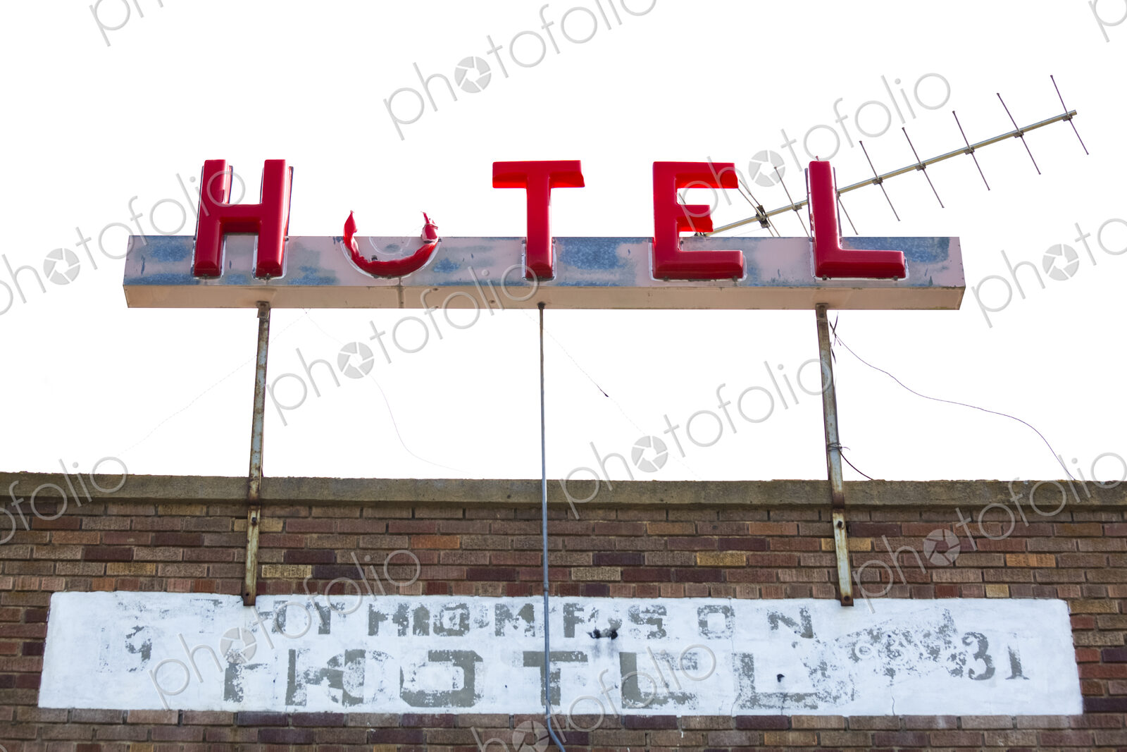 Old hotel sign, Coulee City, a broken sign with part of the O missing.