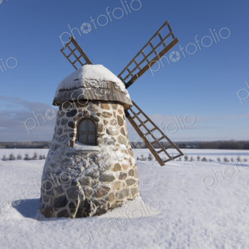 Old stone windmill on snowy landscape at winter. Old stone windmill on snowy landscape at winter.