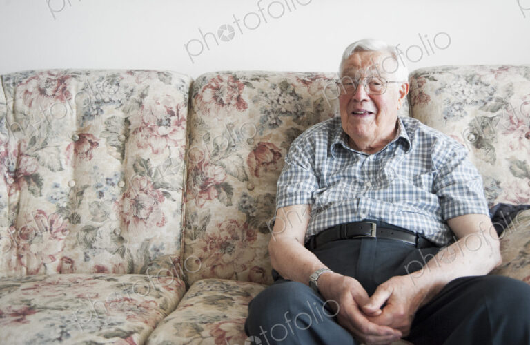 Older man sitting on sofa