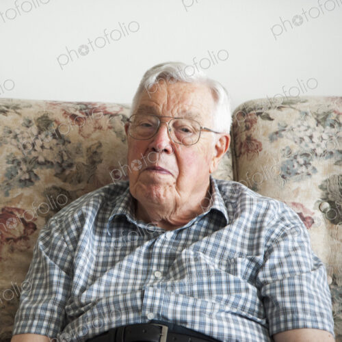 Older man sitting on sofa