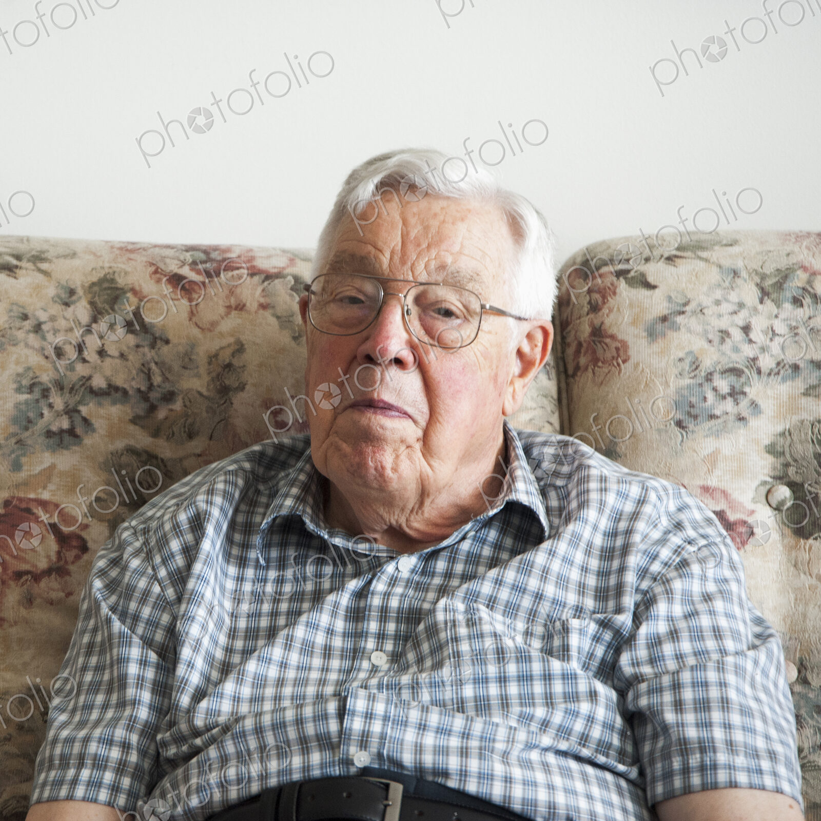 Older man sitting on sofa