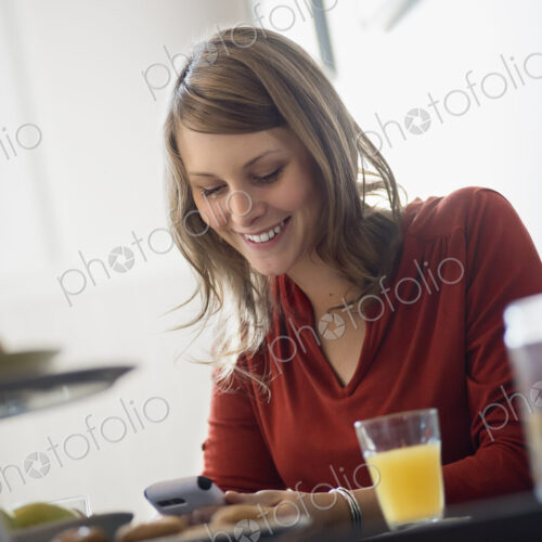One person sitting at a table in a coffeeshop. One person sitting at a table in a coffeeshop.