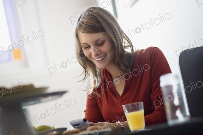 One person sitting at a table in a coffeeshop.