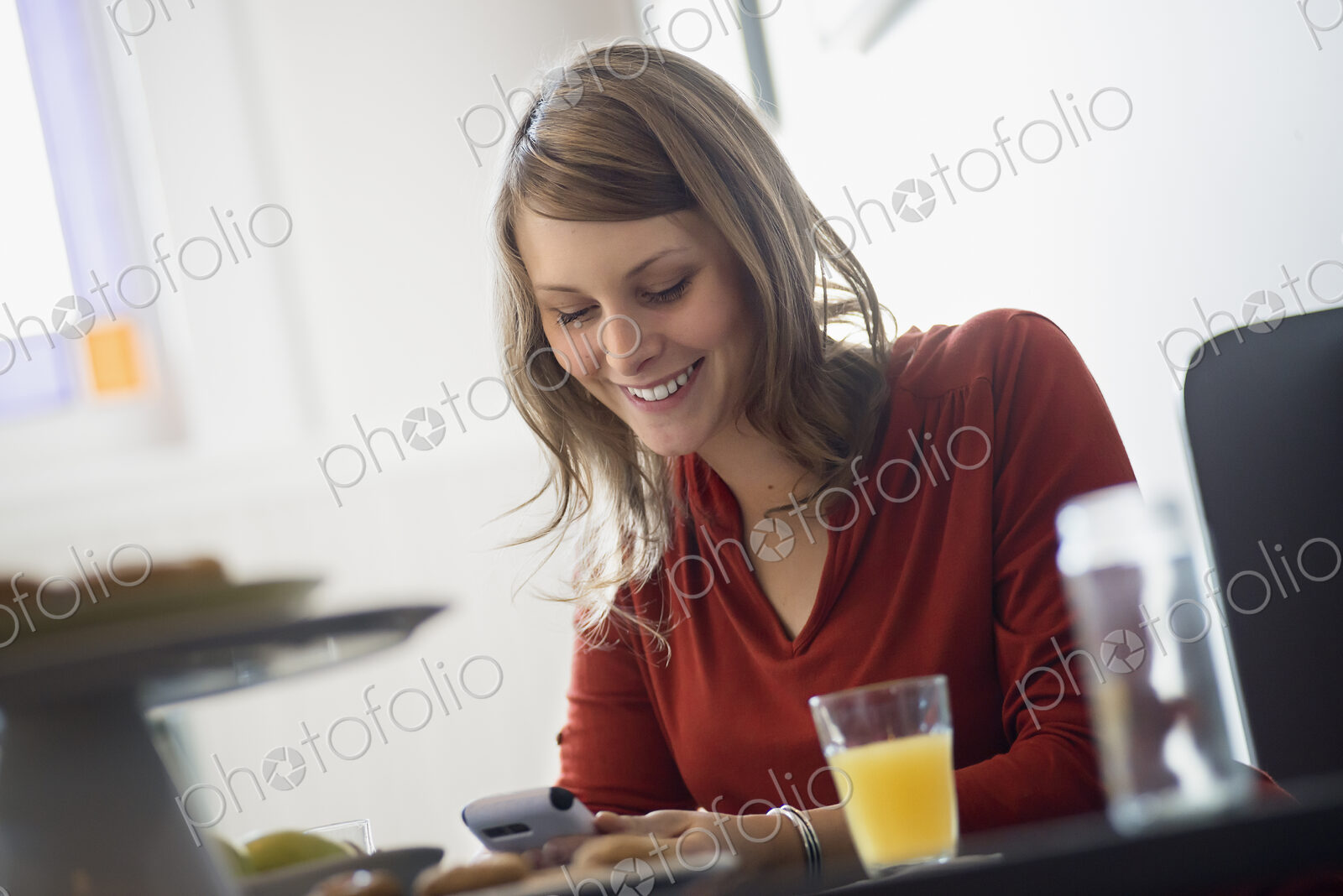 One person sitting at a table in a coffeeshop.