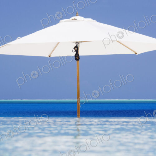 Open Beach Umbrella in Water