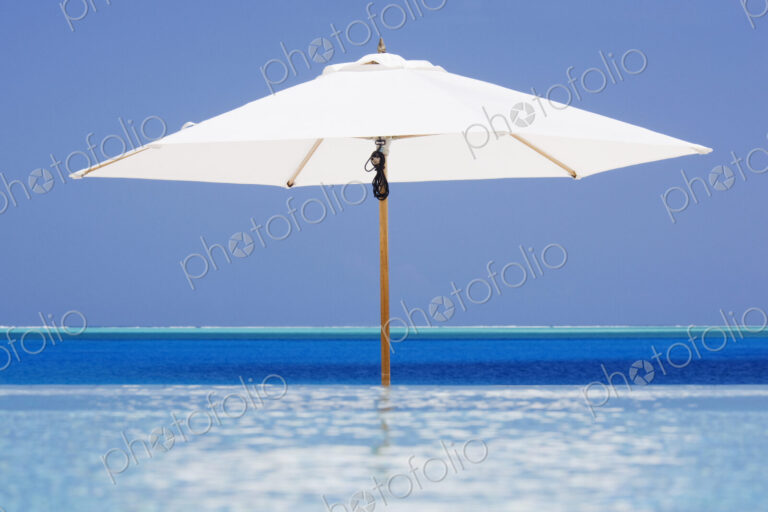 Open Beach Umbrella in Water