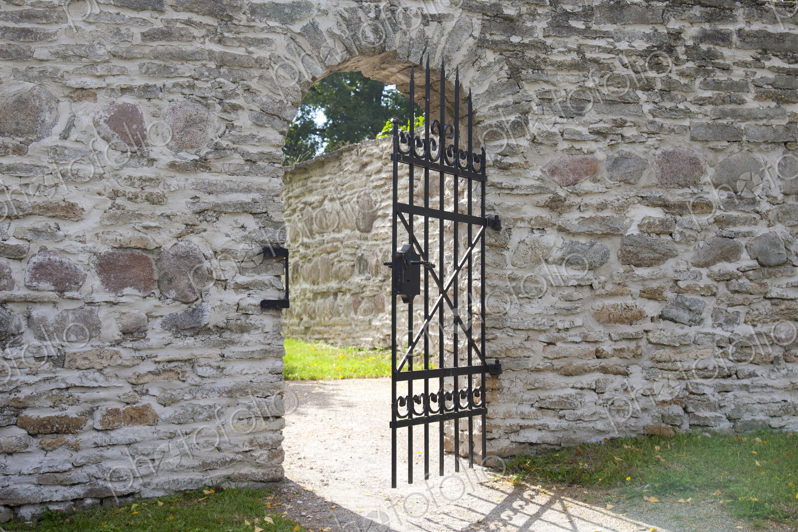 Open Gate Door in a Stone Wall